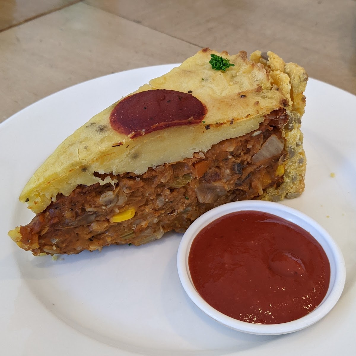 House-made savoury pie slice with tomato relish