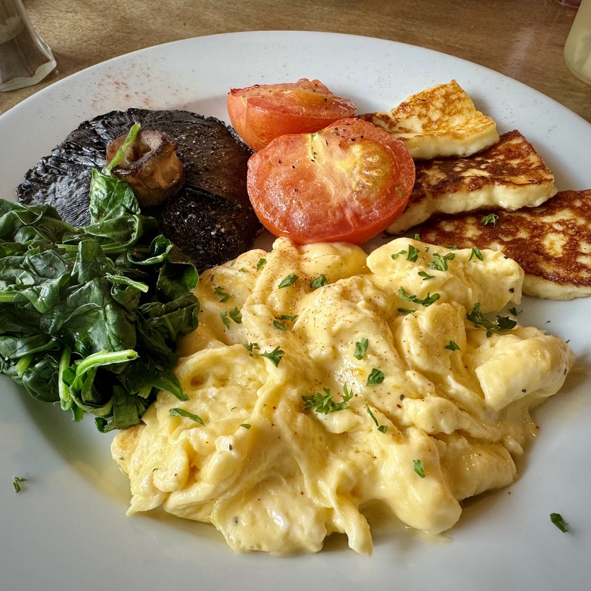 Vegetarian big breakfast with scrambled eggs, halloumi and portobello